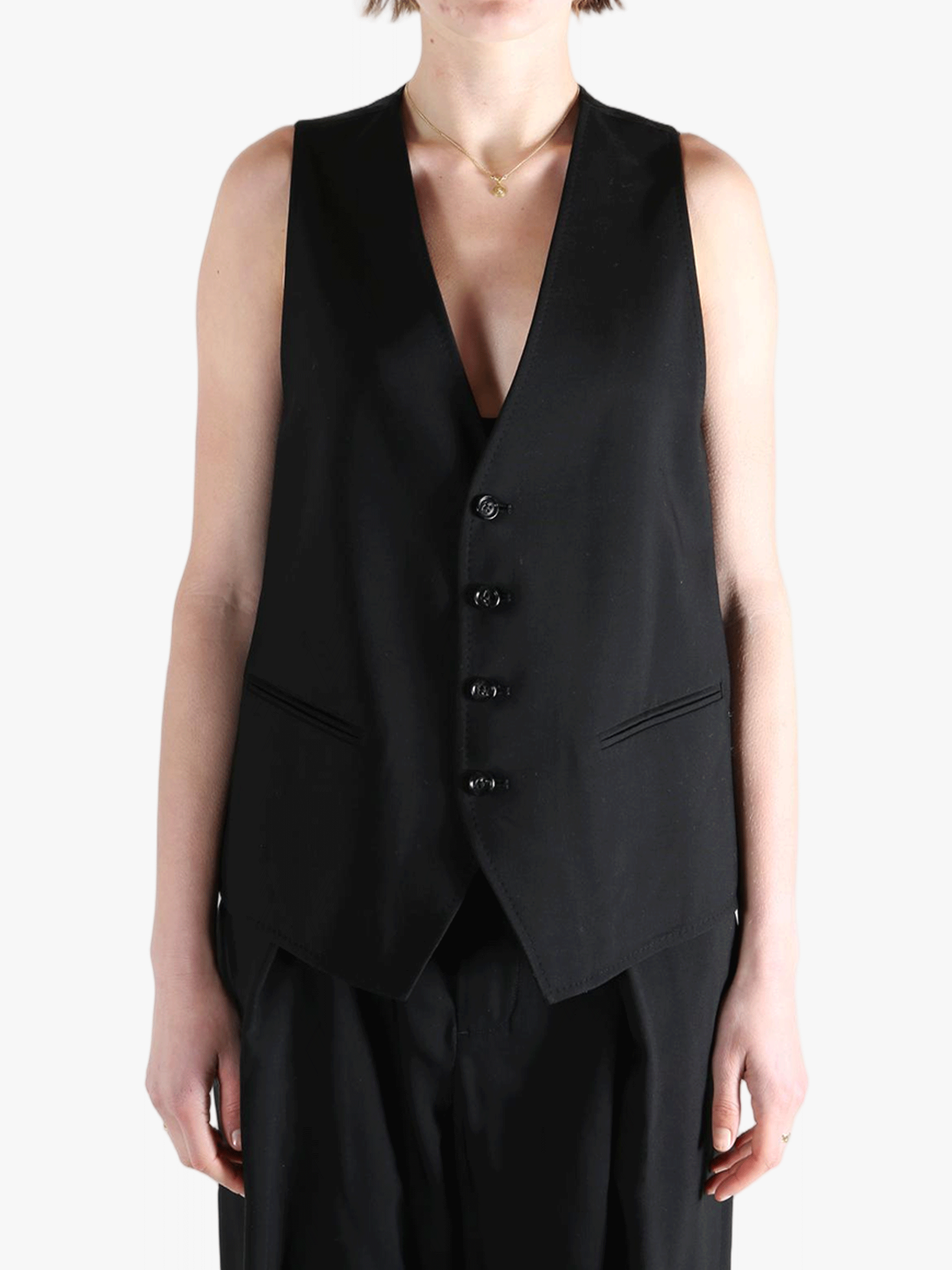 Black top worn by a person, showing the top's fit