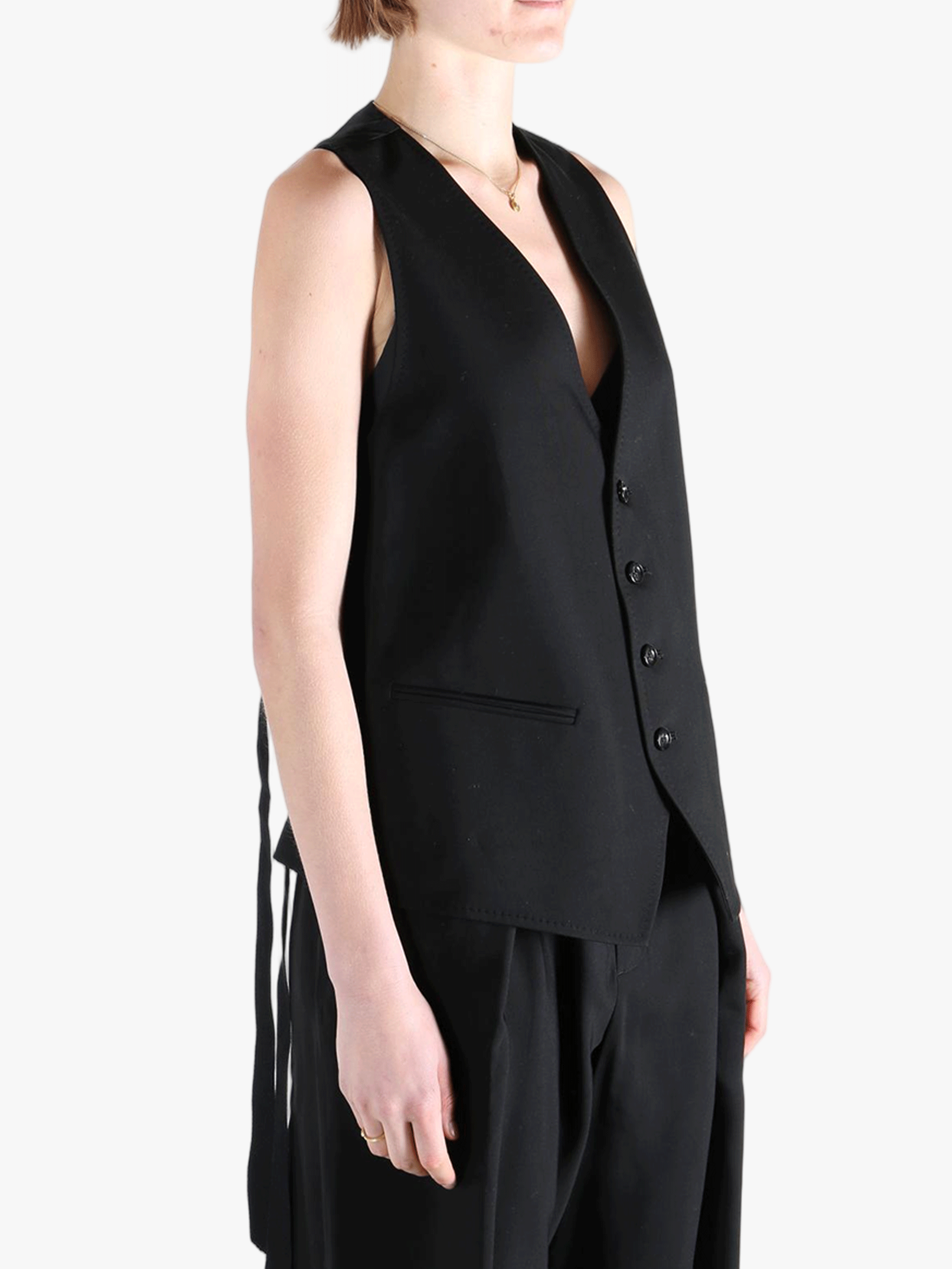 Black top worn by a person, showing the top's fit