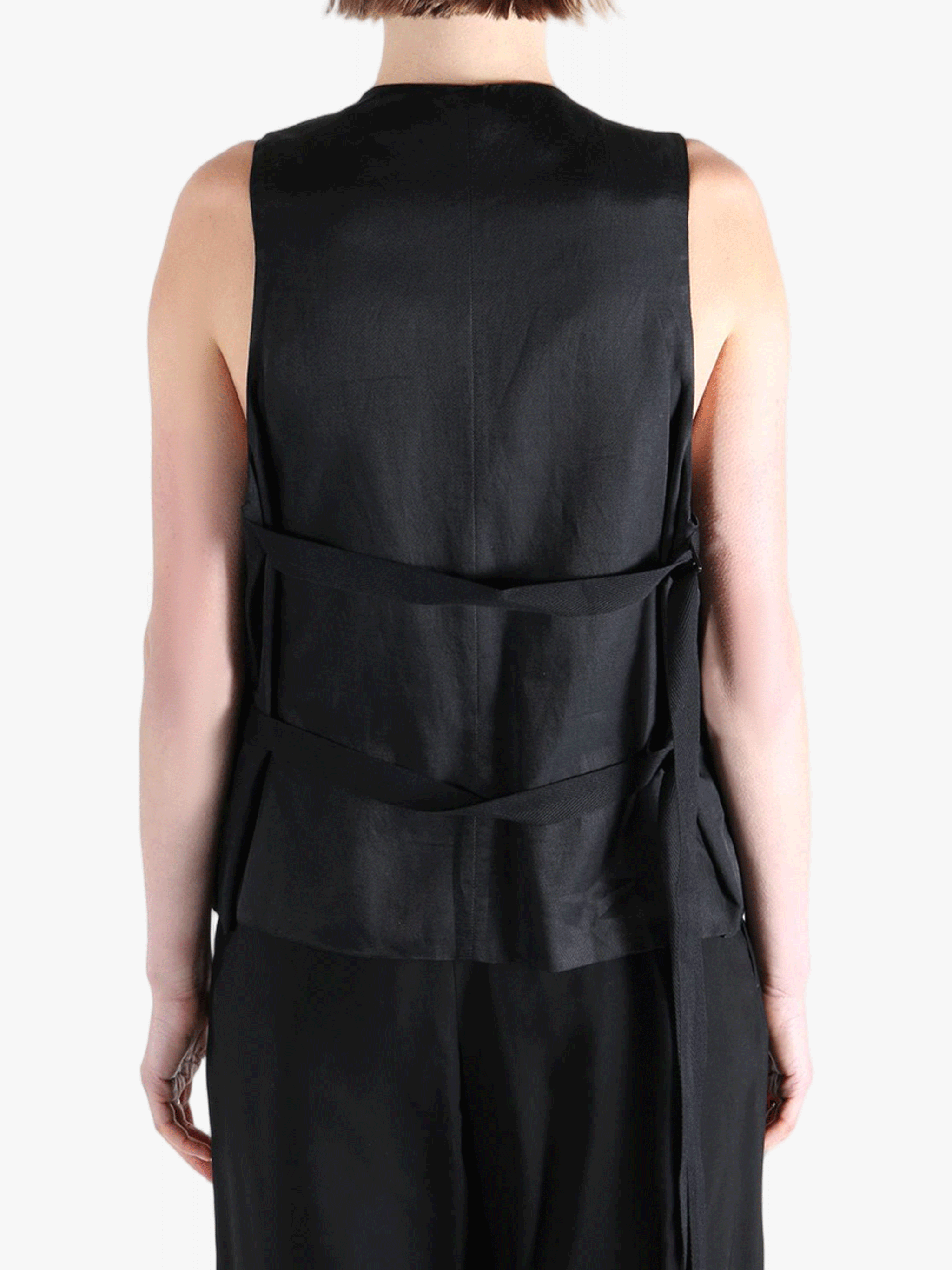 Black top worn by a person, showing the top's fit