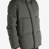 Green jacket worn by a person, showing the coat's fit