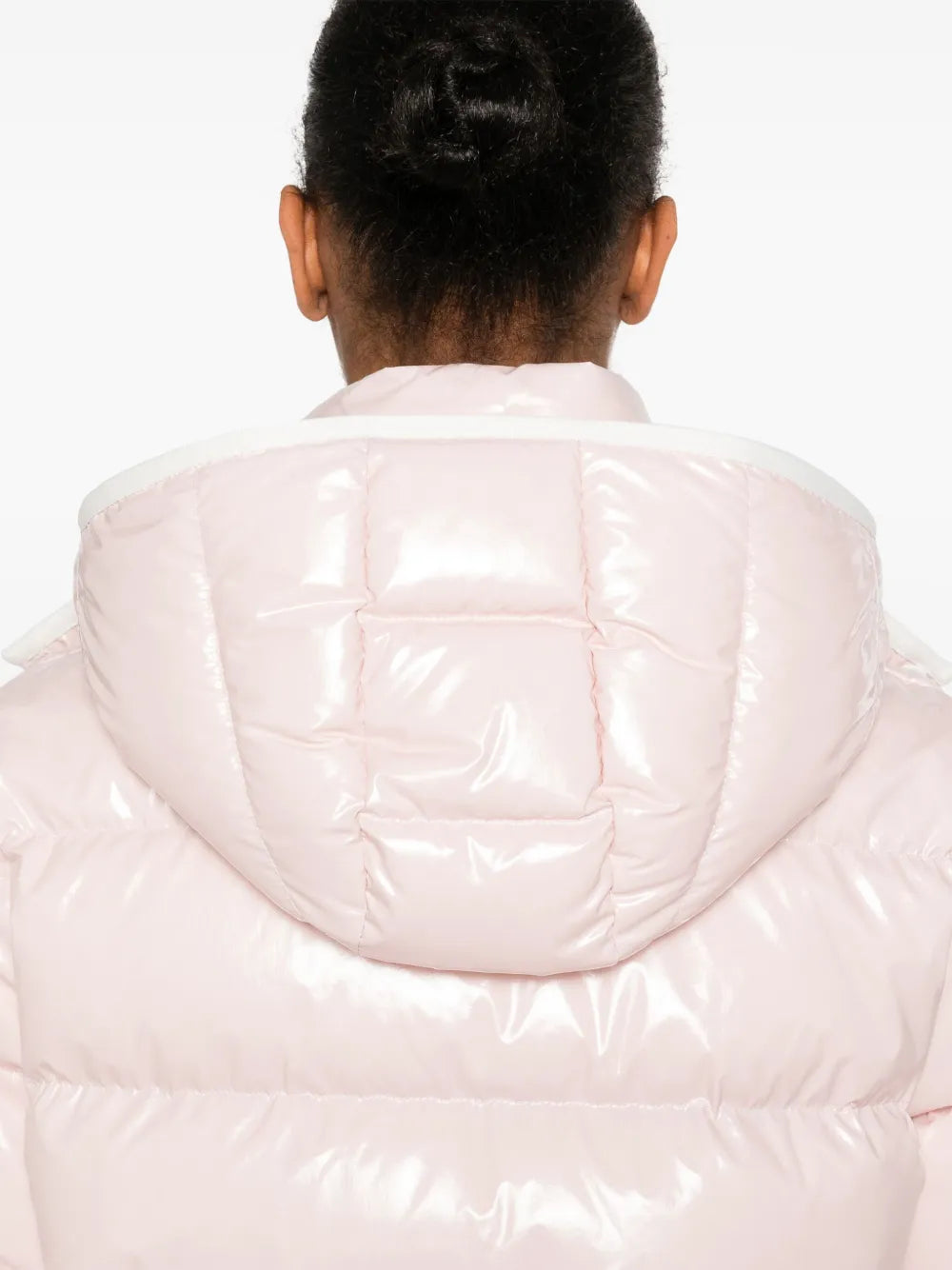 Close up of pink jackets, showing texture of the feather fabric