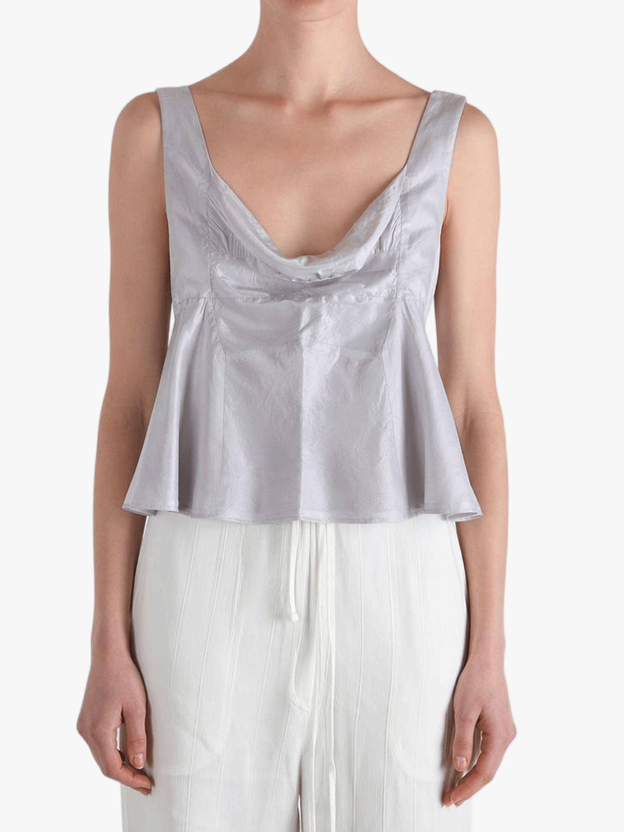 Grey top worn by a person, showing the top's fit