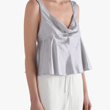 Grey top worn by a person, showing the top's fit