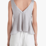 Grey top worn by a person, showing the top's fit