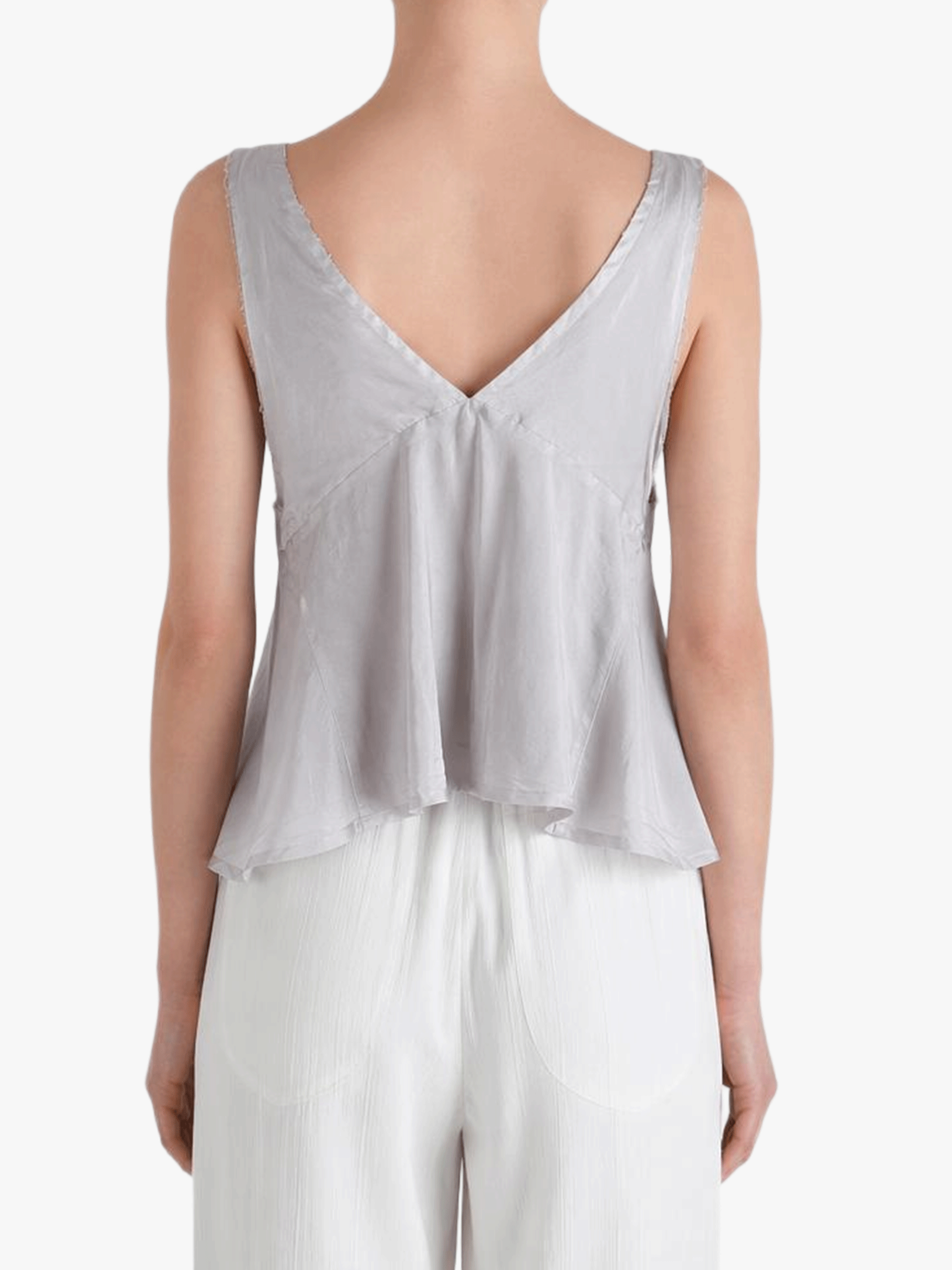 Grey top worn by a person, showing the top's fit