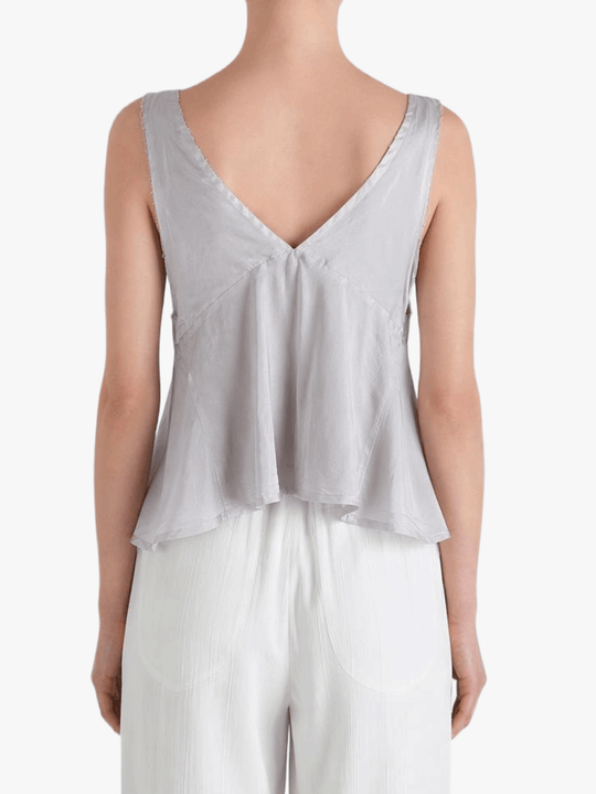 Grey top worn by a person, showing the top's fit