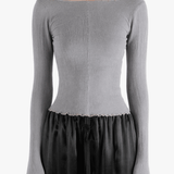 Grey top worn by a person, showing the top fit