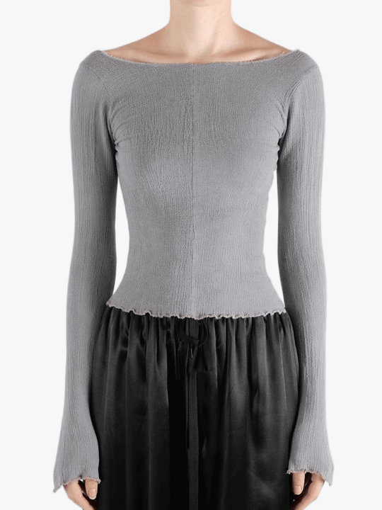 Grey top worn by a person, showing the top fit