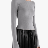Grey top worn by a person, showing the top fit