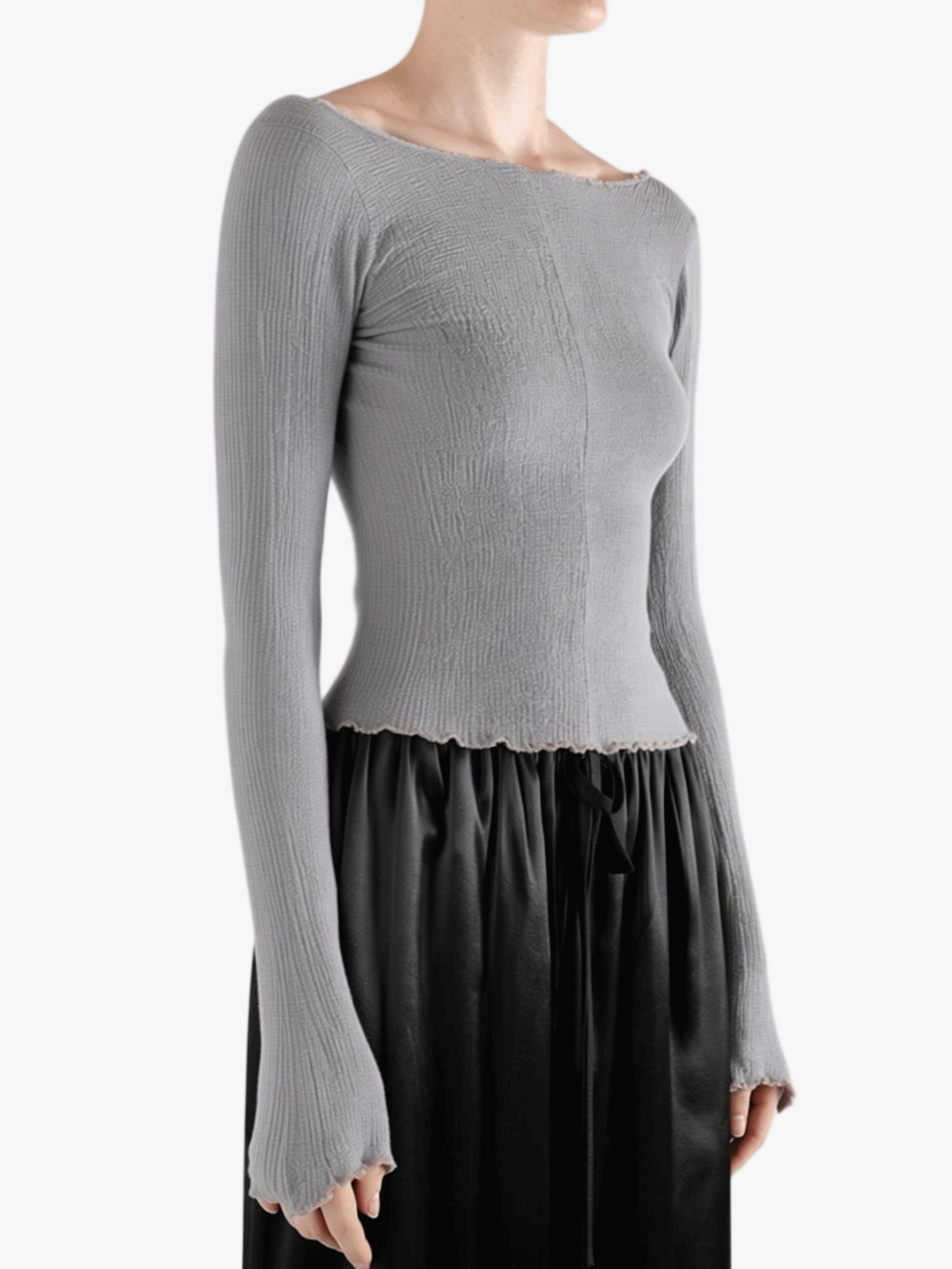 Grey top worn by a person, showing the top fit