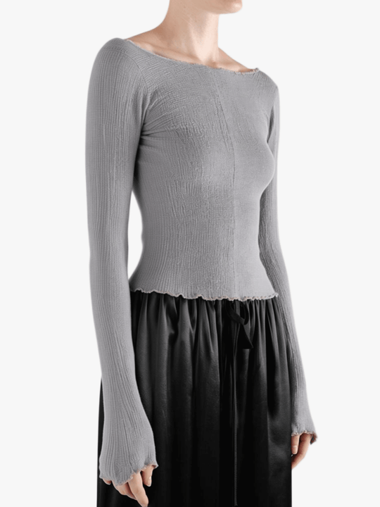 Grey top worn by a person, showing the top fit