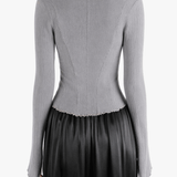 Grey top worn by a person, showing the top fit