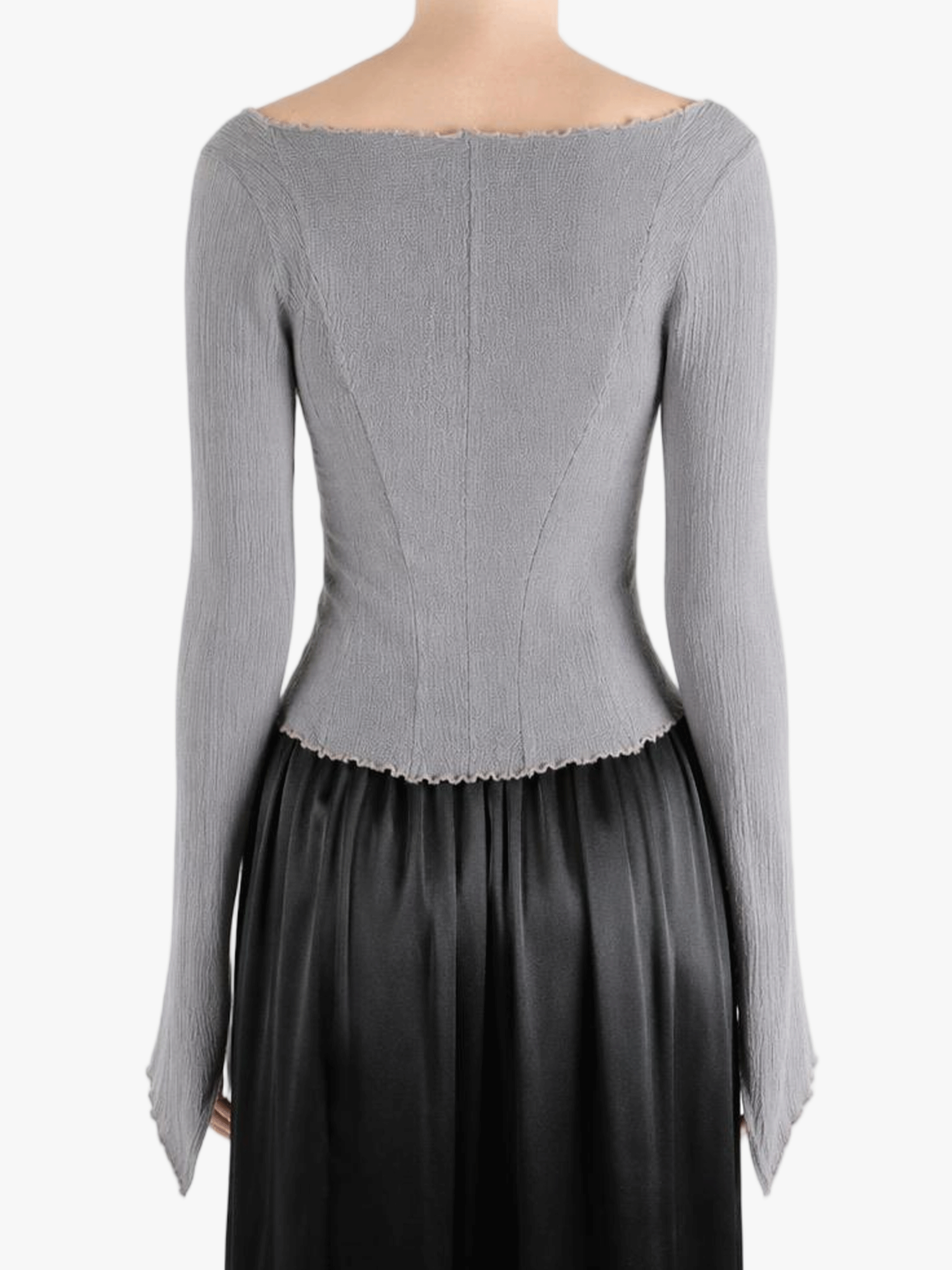 Grey top worn by a person, showing the top fit