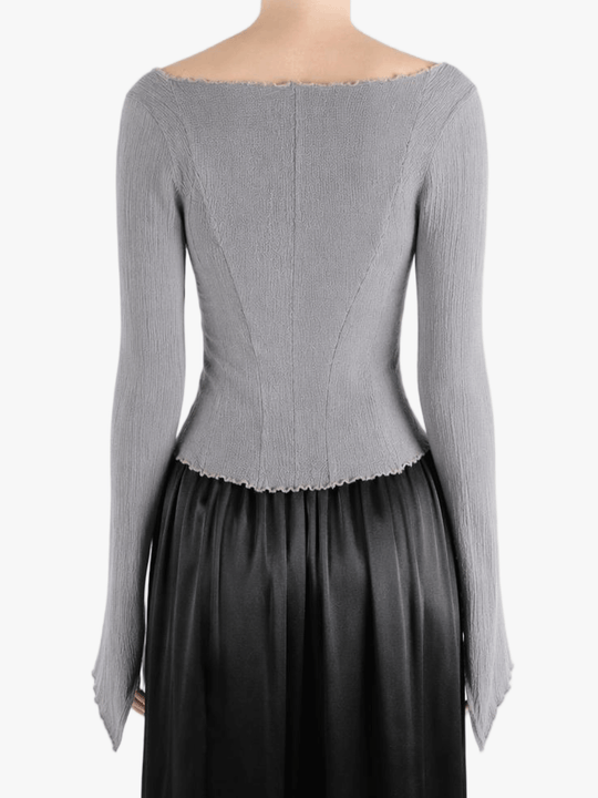 Grey top worn by a person, showing the top fit