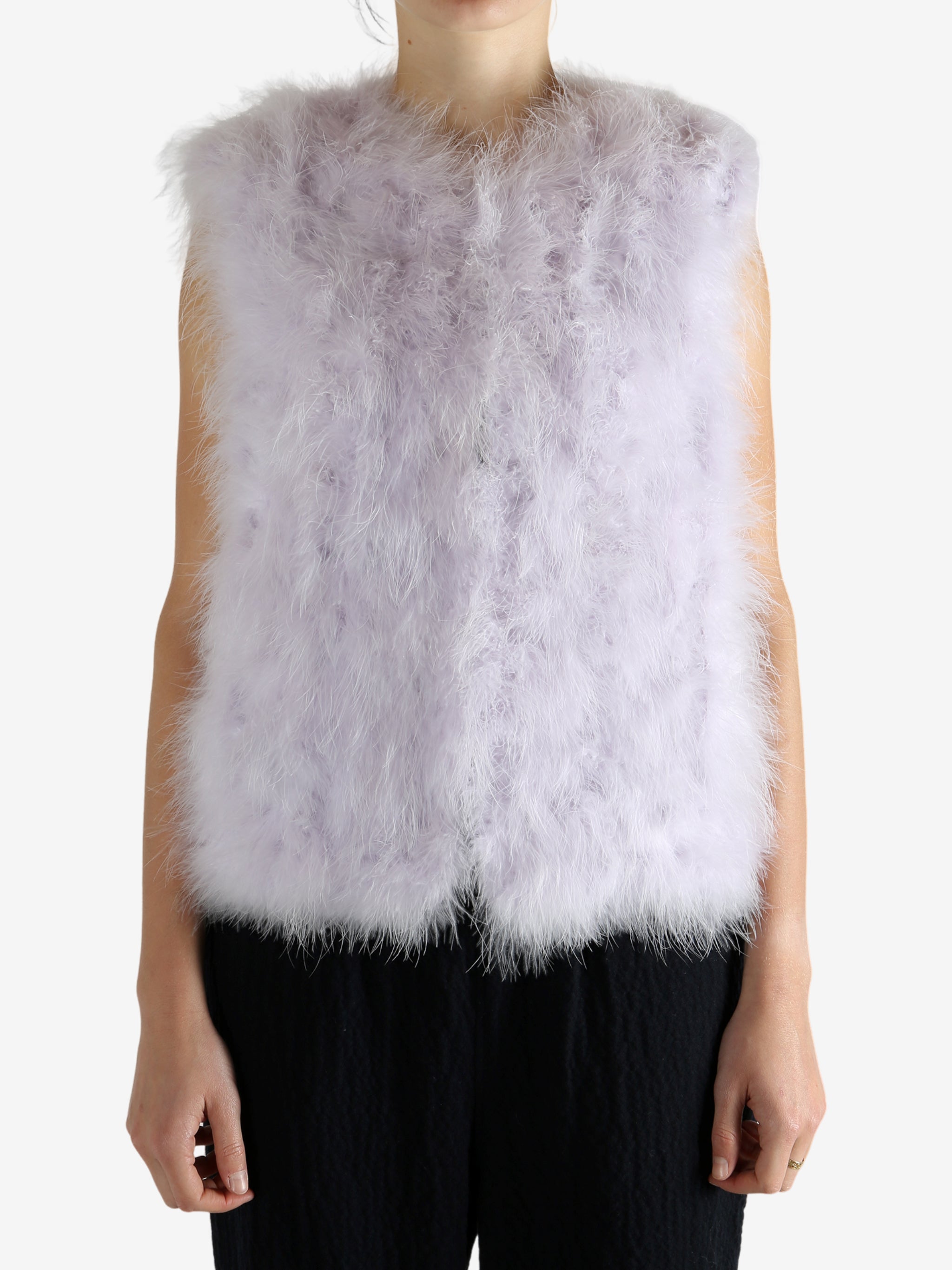 Pink top wonr by a person, showing the pink top's fit