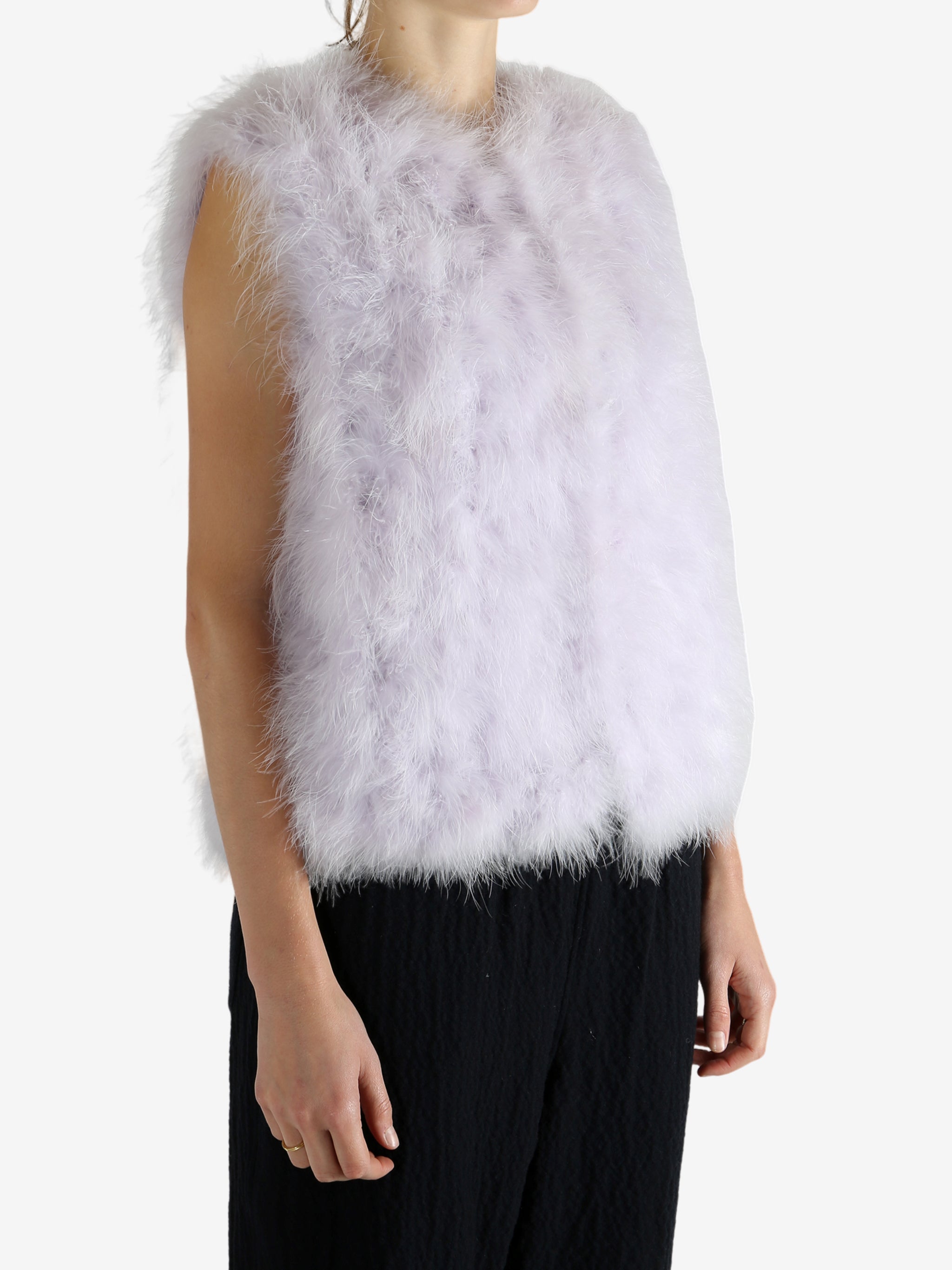 Pink top wonr by a person, showing the pink top's fit