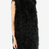 Black gilet worn by a person,showing the gilet's fit