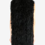 Black gilet worn by a person,showing the gilet's fit