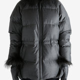 Black jacket worn by a person, showing the jacket fit