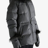 Black jacket worn by a person, showing the jacket fit