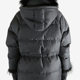 Black jacket worn by a person, showing the jacket fit