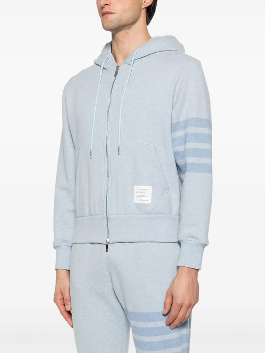 Blue hoodie worn by a person, showing the hoodie's fit