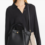 Black bags worn by a person, showing the bags fit