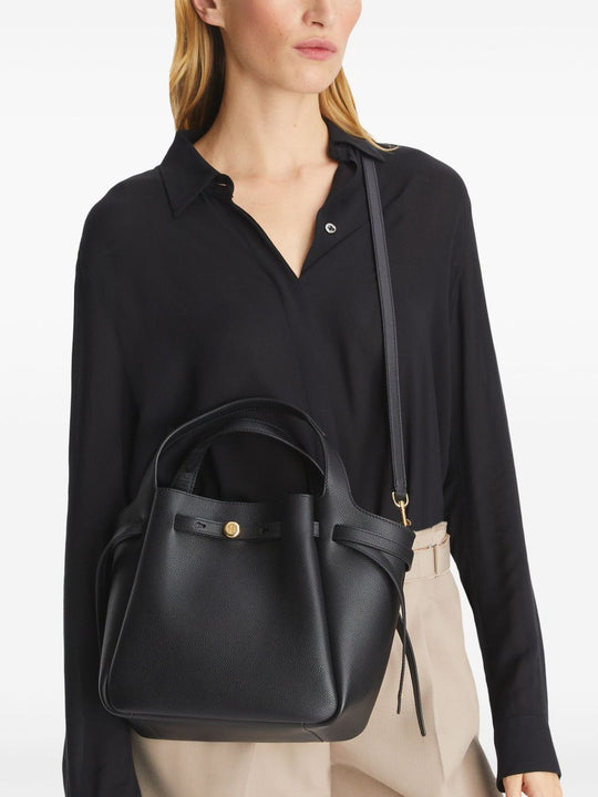 Black bags worn by a person, showing the bags fit