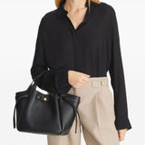 Black bags worn by a person, showing the bags fit