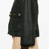 Close up of the black jacket, showing texture of the cotton fabric