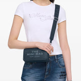 Navy bag worn by a person, showing the bag's fit