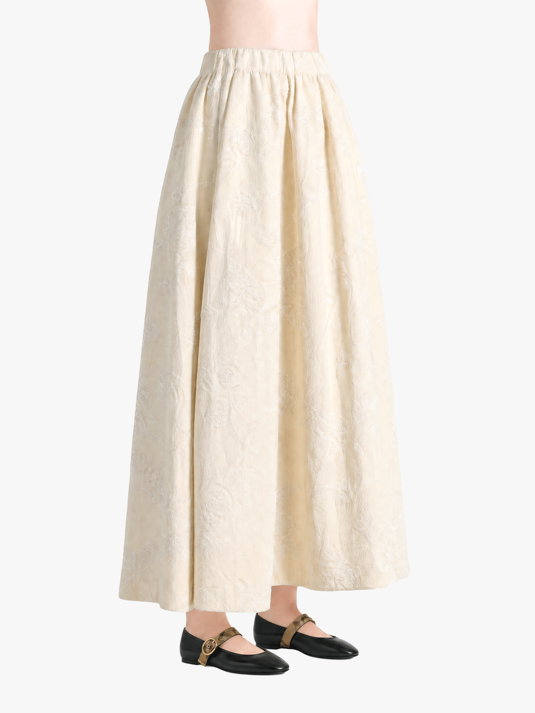 Tan skirt worn by a person, showing the skirt fit