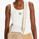 Tan bag worn by a person, showing the bag's fit