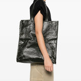 Green bag worn by a person, showing the bag's fit