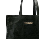 Close up of the green bag, showing texture of the linen/ flax and cotton fabric