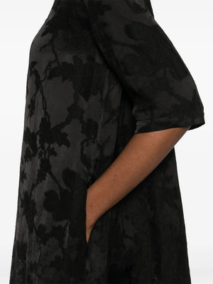 Close up of black dress, showing texture of the linen fabric