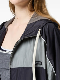 Close up of blue jacket, showing texture of the cotton fabric