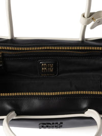 Close up of the black bag, showing texture of the leather fabric