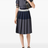 Grey skirt worn by a person, showing the skit's fit