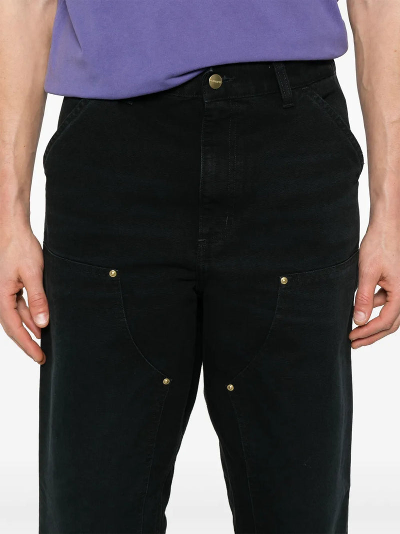 Close up of black pant, showing texture of the cotton fabric