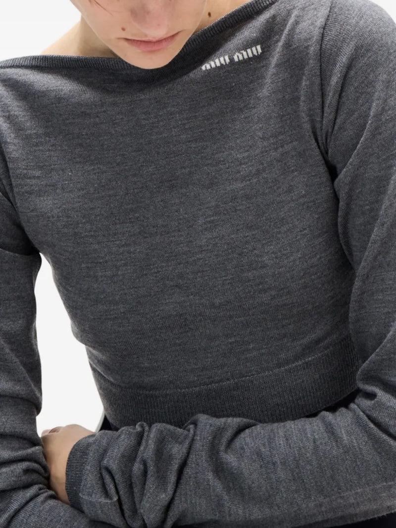 Close up of grey sweater, showing texture of the wool fabric