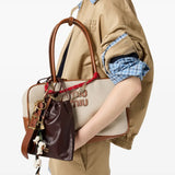 Tan bag worn by a person, showing the  bag's fit