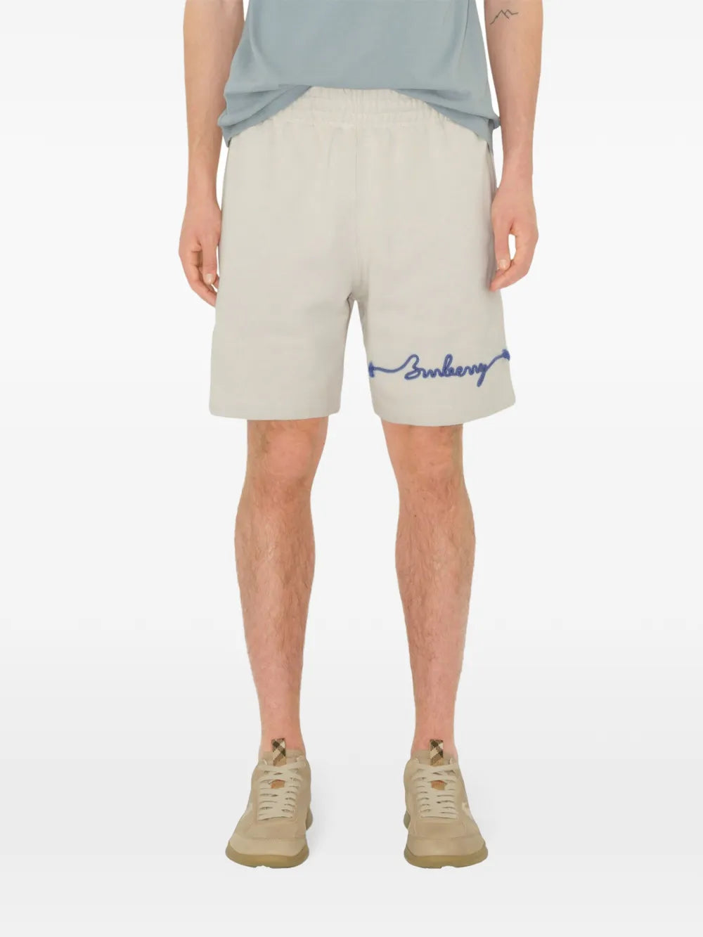 Blue shorts worn by a person, showing the shorts' fit