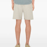 Blue shorts worn by a person, showing the shorts' fit