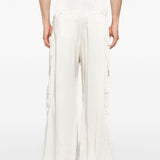 White pant worn by a person, showing the pant’s fit