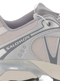 Close up of grey sneaker, showing texture of the mesh fabric