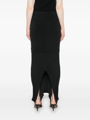 Black midi skirt worn by a person, showing the skirt  fit