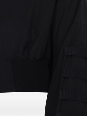 Close up of black jacket, showing texture of lyocell fabric