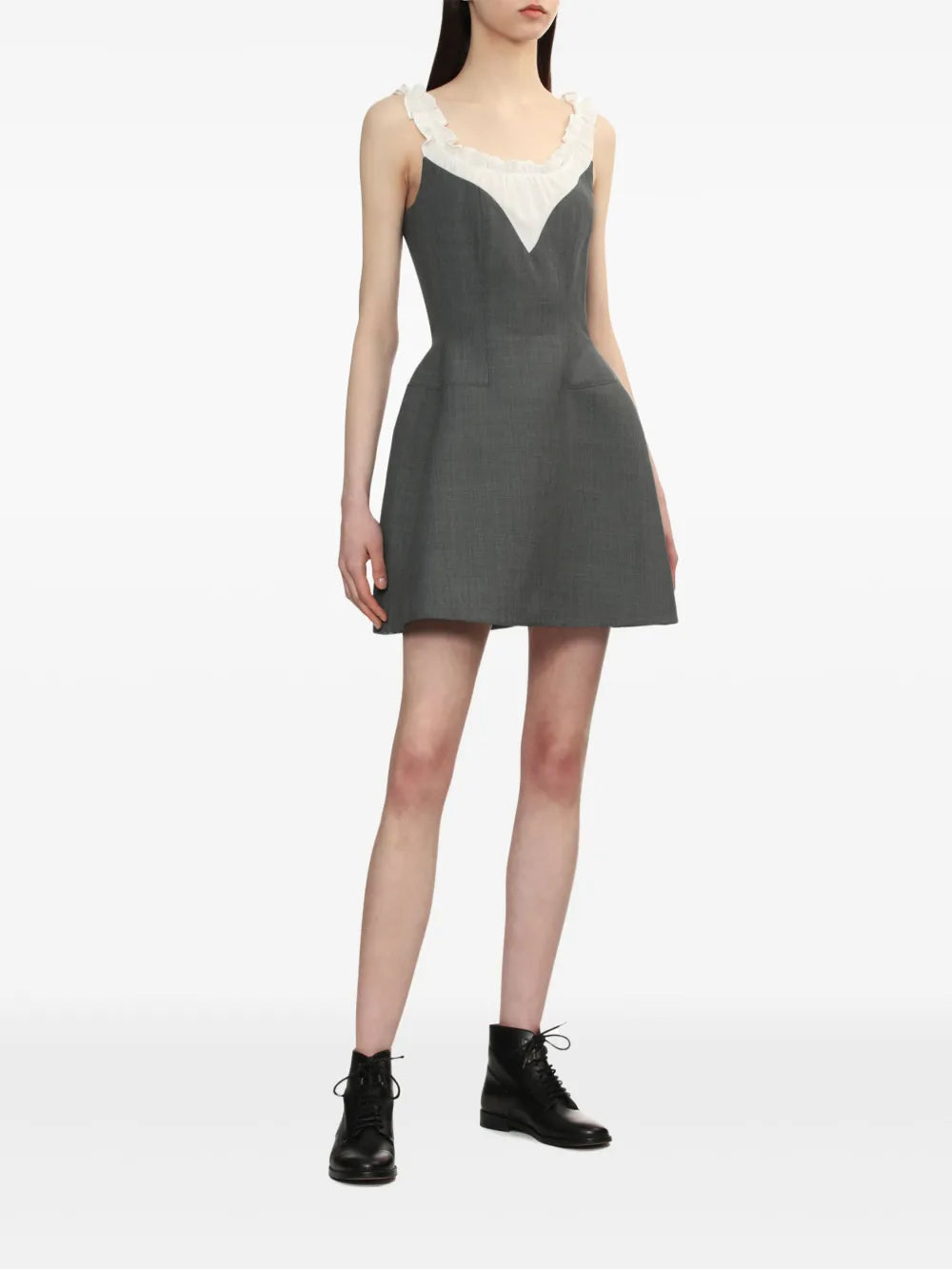 Grey dress worn by a person, showing the dress' fit
