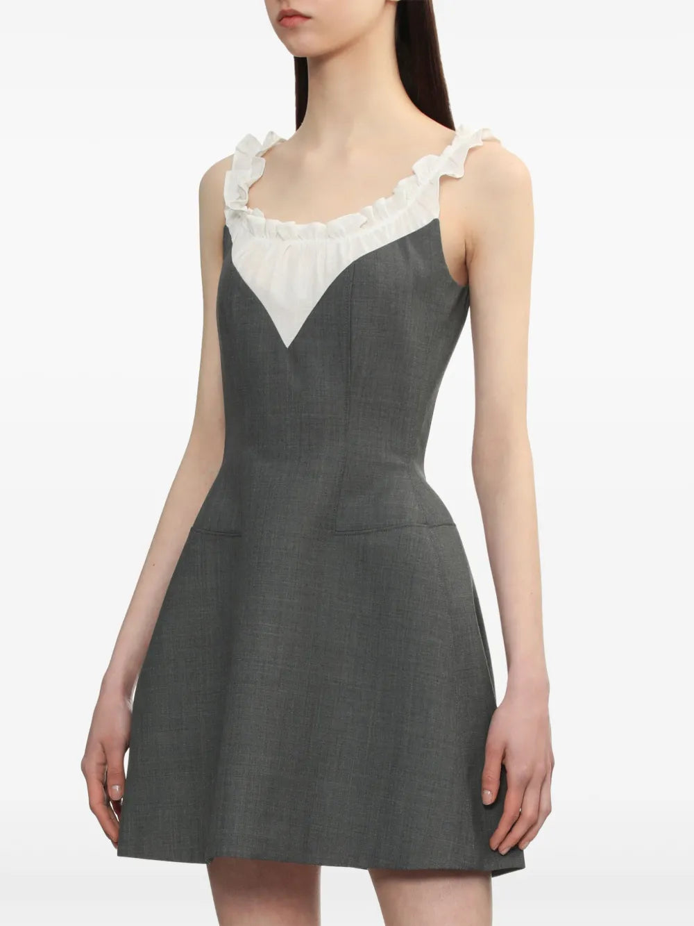 Grey dress worn by a person, showing the dress' fit